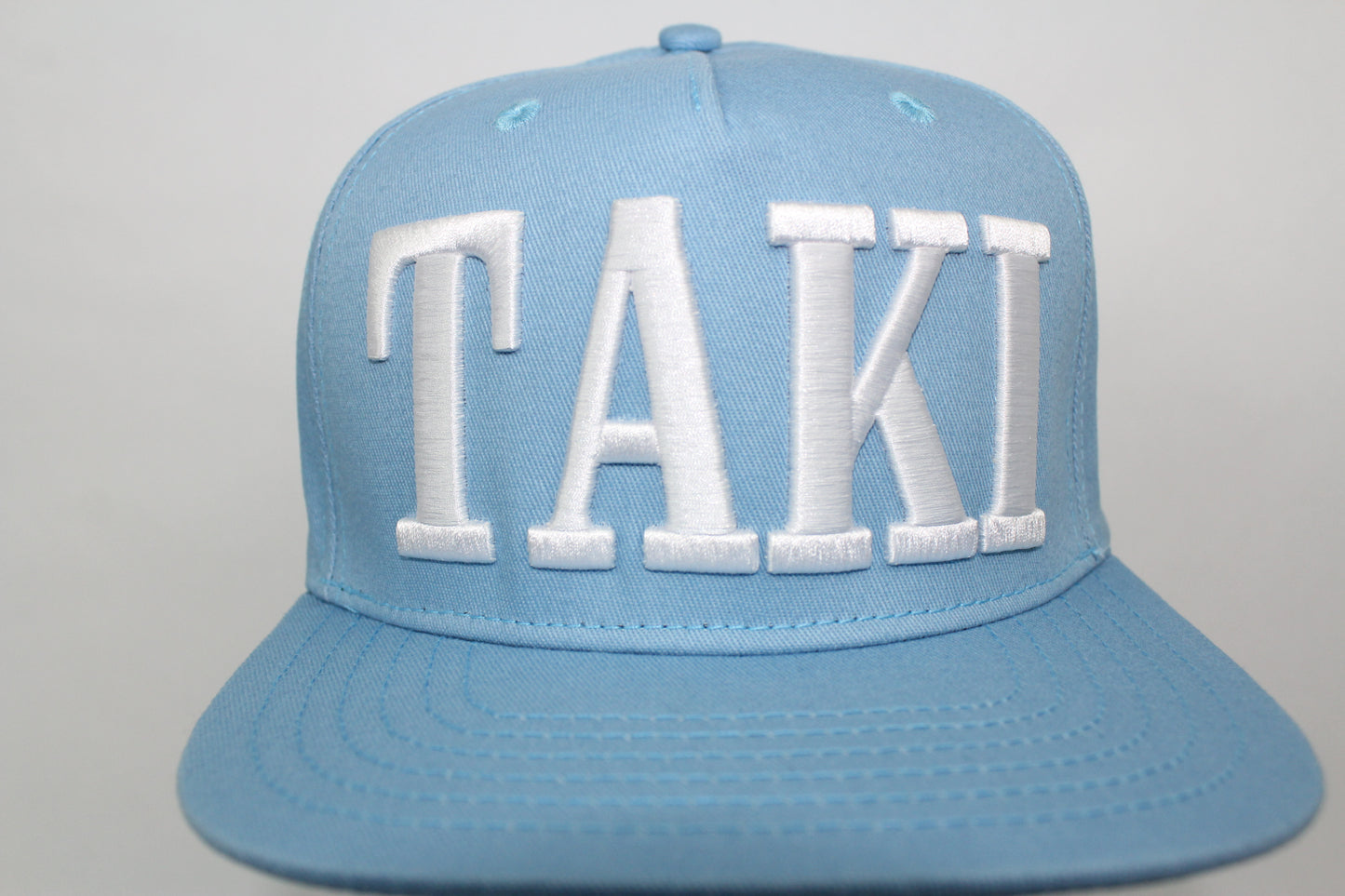 TAKI Baby Blue Snap Back hat